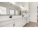 Modern bathroom with double vanity and frameless shower at 16412 W Avenida Del Sol --, Surprise, AZ 85387
