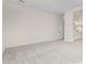 Bright bedroom with neutral carpeting and door to bathroom at 16412 W Avenida Del Sol --, Surprise, AZ 85387