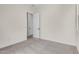 Bedroom with carpet flooring and access to another room at 16412 W Avenida Del Sol --, Surprise, AZ 85387