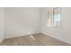 Bright bedroom with light wood flooring and a window at 16412 W Avenida Del Sol --, Surprise, AZ 85387