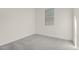Simple bedroom with gray carpet and a window at 16412 W Avenida Del Sol --, Surprise, AZ 85387
