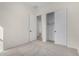 Bright bedroom with gray carpet and a closet at 16412 W Avenida Del Sol --, Surprise, AZ 85387