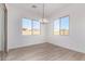 Spacious dining room with large windows and a chandelier at 16412 W Avenida Del Sol --, Surprise, AZ 85387