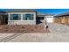 House exterior with two-car garage and landscaping at 16412 W Avenida Del Sol --, Surprise, AZ 85387