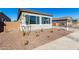 House exterior with landscaping and stone accents at 16412 W Avenida Del Sol --, Surprise, AZ 85387