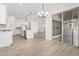 Open concept kitchen with island, dining area, and access to a patio at 16412 W Avenida Del Sol --, Surprise, AZ 85387