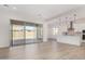 Open concept living room with sliding glass doors leading to the backyard at 16412 W Avenida Del Sol --, Surprise, AZ 85387