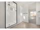 Walk-in shower with white subway tile and frameless glass at 16412 W Avenida Del Sol --, Surprise, AZ 85387