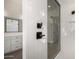 Modern shower with white tile and black accents at 16412 W Avenida Del Sol --, Surprise, AZ 85387