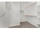 Large walk-in closet with double hanging rods and shelving at 16412 W Avenida Del Sol --, Surprise, AZ 85387