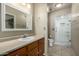 Bathroom boasts a large vanity and a walk-in shower at 7950 E Keats Ave # 133, Mesa, AZ 85209