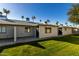 Exterior view of multiple units, showcasing a well-maintained lawn and building design at 7950 E Keats Ave # 133, Mesa, AZ 85209