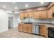 Modern kitchen with stainless steel appliances and light wood cabinets at 7950 E Keats Ave # 133, Mesa, AZ 85209