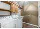 Laundry room with washer, dryer, and cabinets at 7950 E Keats Ave # 133, Mesa, AZ 85209