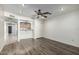 Living room with wood-look flooring, and a view into the kitchen at 7950 E Keats Ave # 133, Mesa, AZ 85209