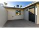 Private patio with access from the unit. Features a metal security door and a window at 7950 E Keats Ave # 133, Mesa, AZ 85209