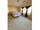 Spacious bedroom with a queen bed and large window with curtains at 17572 W Dalea Dr, Goodyear, AZ 85338