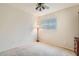 Neutral bedroom with a ceiling fan, a window with blinds, and carpet at 4803 E Barwick Dr, Cave Creek, AZ 85331