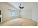 Spacious bedroom featuring a ceiling fan and large window at 4803 E Barwick Dr, Cave Creek, AZ 85331