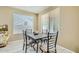 Cozy dining area with decorative tile table, seating four, and bright natural light at 4803 E Barwick Dr, Cave Creek, AZ 85331