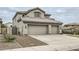 Charming two-story home featuring a three-car garage and desert landscaping at 4803 E Barwick Dr, Cave Creek, AZ 85331