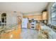 Bright kitchen with granite countertops and a breakfast bar at 4803 E Barwick Dr, Cave Creek, AZ 85331
