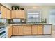Bright kitchen features granite countertops, wood cabinets, and stainless steel appliances at 4803 E Barwick Dr, Cave Creek, AZ 85331