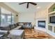 Cozy living room featuring wood floors and a fireplace at 4803 E Barwick Dr, Cave Creek, AZ 85331