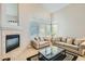 Spacious living room with a fireplace and large windows at 4803 E Barwick Dr, Cave Creek, AZ 85331