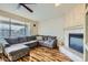 Living room featuring wood floors, fireplace, and natural light at 4803 E Barwick Dr, Cave Creek, AZ 85331