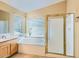 Bright bathroom with soaking tub and glass enclosed shower at 4803 E Barwick Dr, Cave Creek, AZ 85331