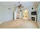 Bright main bedroom with fireplace and view into ensuite bathroom at 4803 E Barwick Dr, Cave Creek, AZ 85331