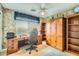 Office space featuring built-in shelves and desk, ceiling fan, and bright natural light at 4803 E Barwick Dr, Cave Creek, AZ 85331