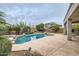 Backyard pool with a desert landscape, stamped concrete, and privacy wall at 4803 E Barwick Dr, Cave Creek, AZ 85331