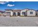 Charming single-story home with stucco exterior, tile roof, and well-manicured front yard at 11249 N Blakely St, Surprise, AZ 85388