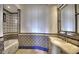 Spa-like bathroom with tile details and a soaking tub at 5842 E Redwing Rd, Paradise Valley, AZ 85253
