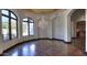 Formal dining room with hardwood floors, large windows, and a crystal chandelier at 5842 E Redwing Rd, Paradise Valley, AZ 85253