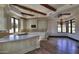 Eat-in kitchen features hardwood floors and a charming chandelier at 5842 E Redwing Rd, Paradise Valley, AZ 85253
