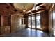 Elegant library with hardwood floors, built-in bookcases, and French doors at 5842 E Redwing Rd, Paradise Valley, AZ 85253