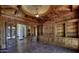 Luxurious library with custom built-in shelving and hardwood floors at 5842 E Redwing Rd, Paradise Valley, AZ 85253