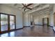 Spacious living area with hardwood floors, fireplace, and French doors at 5842 E Redwing Rd, Paradise Valley, AZ 85253
