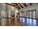 Spacious living room with hardwood floors, fireplace, and access to backyard at 5842 E Redwing Rd, Paradise Valley, AZ 85253