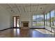 Living room with hardwood floors, fireplace, and stunning mountain views at 5842 E Redwing Rd, Paradise Valley, AZ 85253