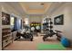Well-equipped home gym featuring various exercise machines and weights at 10751 E Candlewood Dr, Scottsdale, AZ 85255