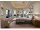 Spacious main bedroom with large windows and stylish furnishings at 10751 E Candlewood Dr, Scottsdale, AZ 85255