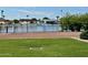 Backyard view of a lakefront property with a grassy area at 10330 W Thunderbird Blvd # C115, Sun City, AZ 85351