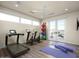 Bright exercise room with a treadmill, stationary bikes, yoga mats, and fitness balls at 6296 N Lost Dutchman Dr, Paradise Valley, AZ 85253