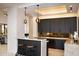 Wet bar with dark wood cabinetry and marble countertops at 29646 N 109Th Pl # 128, Scottsdale, AZ 85262