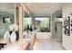 Spa-like bathroom with soaking tub and large window at 29646 N 109Th Pl # 128, Scottsdale, AZ 85262
