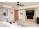 Main bedroom with fireplace and large TV at 29646 N 109Th Pl # 128, Scottsdale, AZ 85262
